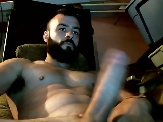 sexy bearded stud stroking his juicy meat